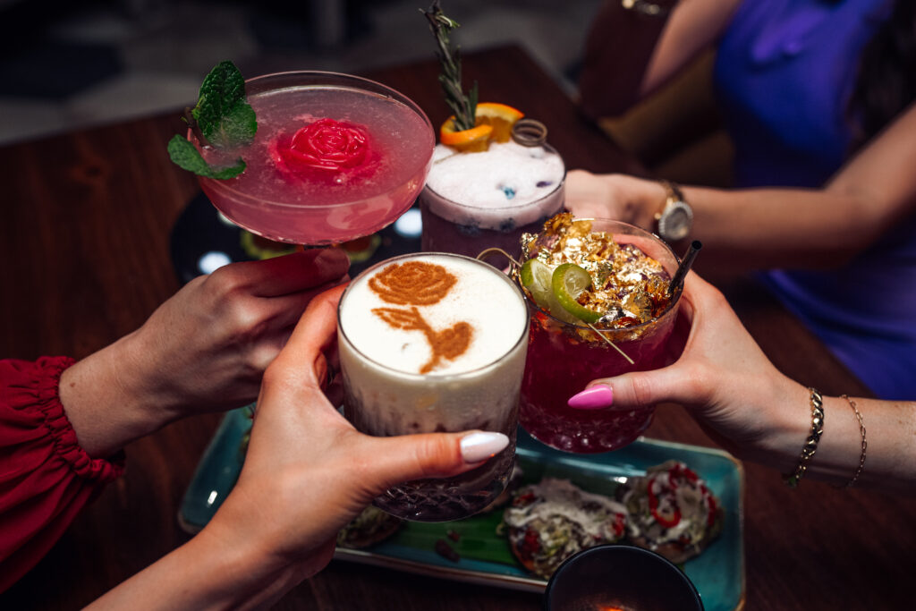 Signature cocktails at La Neta Cocina y Lounge including The Marg and Picante Mango