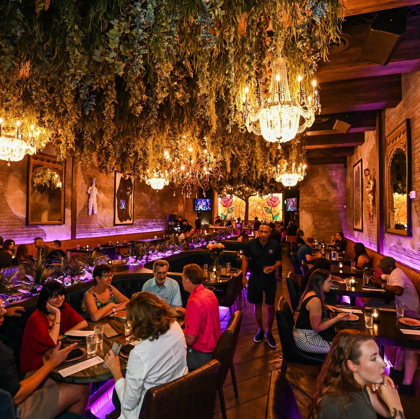 Vibrant interior of La Neta in Las Vegas, where guests enjoying the lively dining atmosphere often come searching for the best grilled chicken taco nearby