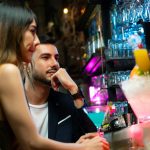 What defines a modern Mexican restaurant experience in Las Vegas? Guests enjoying craft cocktails at La Neta’s vibrant bar.