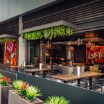 What defines a modern Mexican restaurant experience in Las Vegas? The stylish exterior and patio dining area at La Neta Cocina y Lounge.